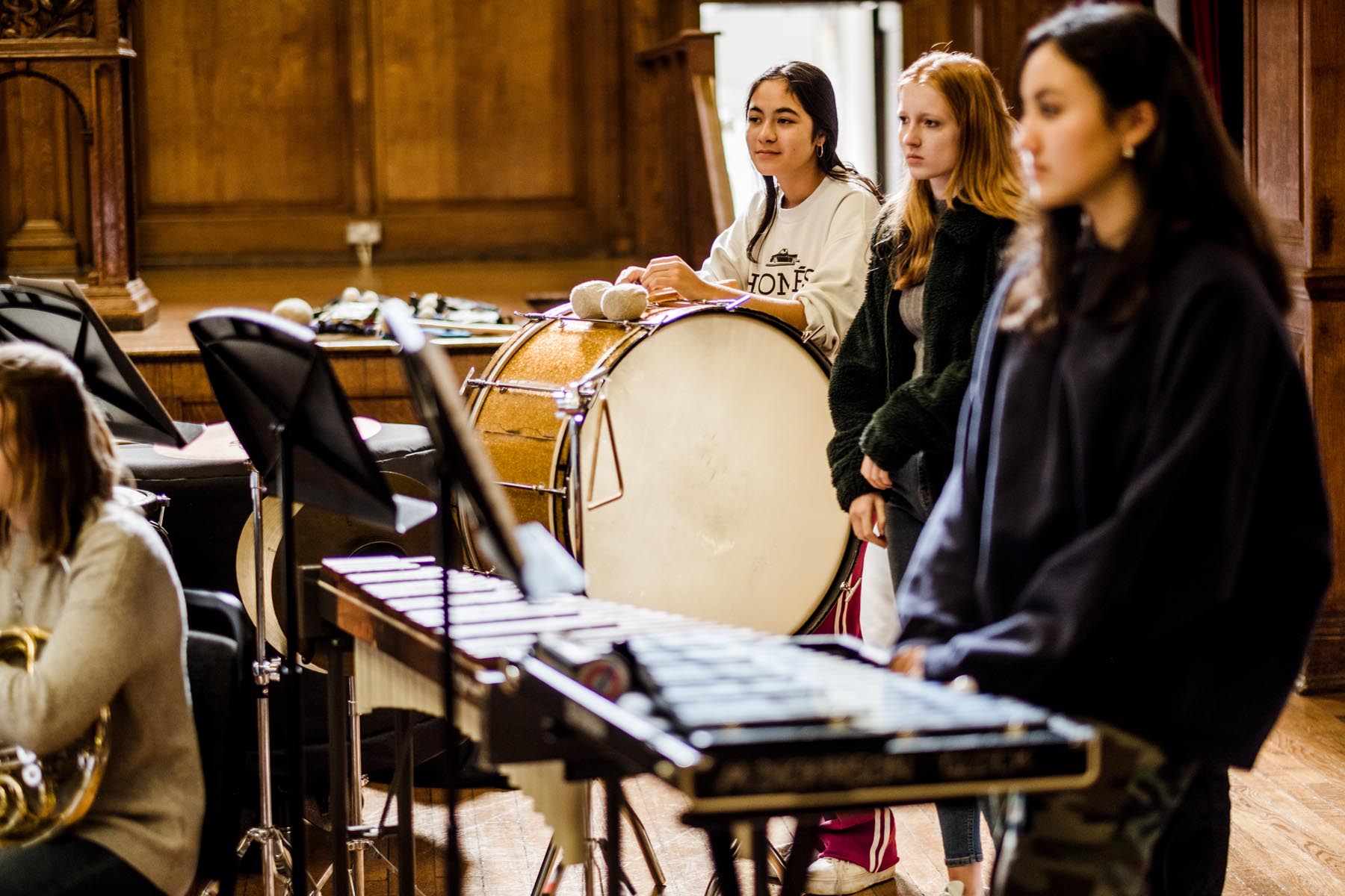 Students playing instruments in the Great Hall.