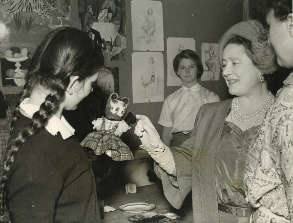 HM Elizabeth, the Queen Mother, on her first visit to the school in 1954.