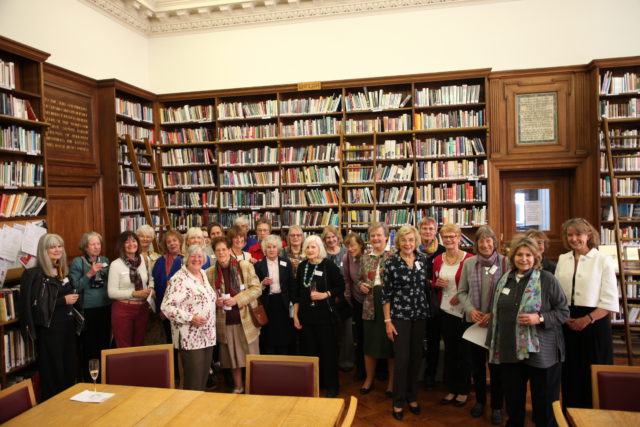 A group of SPGS Alumnae in the school library, with the High Mistress.