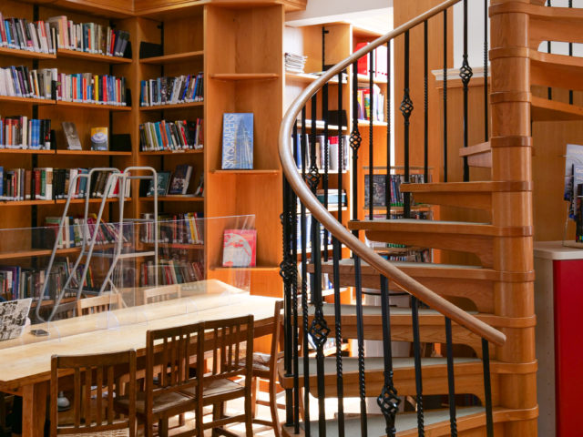 Spiral staircase and interior of Colet Library.