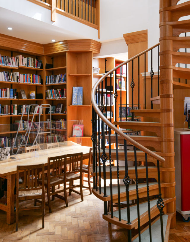 Spiral staircase and interior of Colet Library.