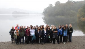 Students and teachers by the lake on the trip to North-West England