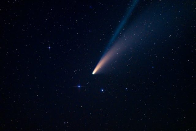 A comet flying through the night sky