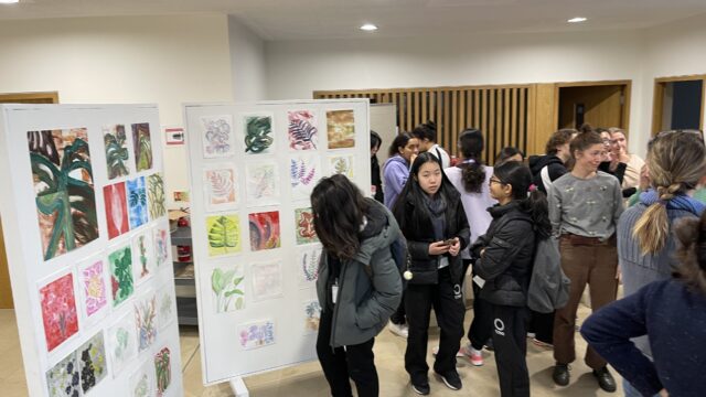 Students and staff attending the art exhibition